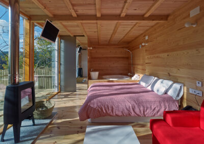 Dormitorio en cabaña de madera